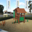 Alt: Drewniany plac zabaw Nannas Playhouse na placu z żółtym piaskiem.